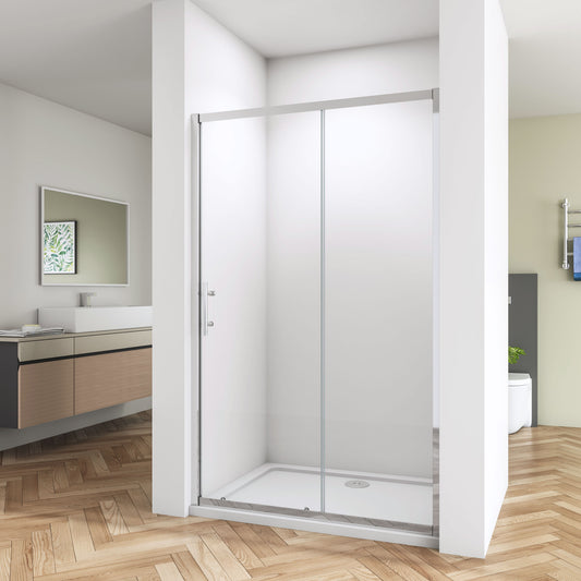 A sliding shower enclosure made of clear glass with a chrome frame, installed in a bathroom setting.